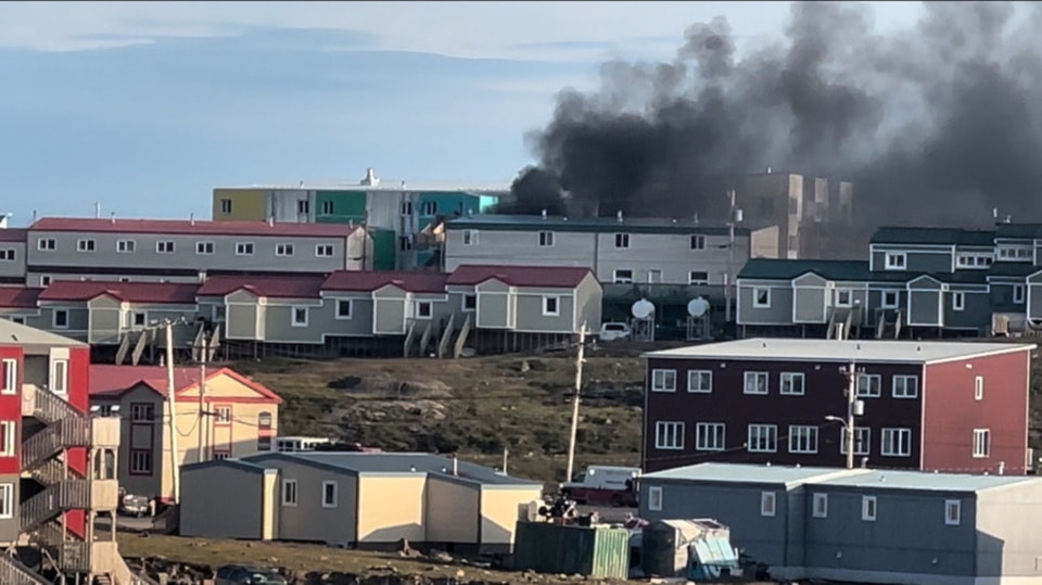 Fire on Iqaluit's Tundra Ridge with emergency vehicles en route, taken about 7:10 pm.