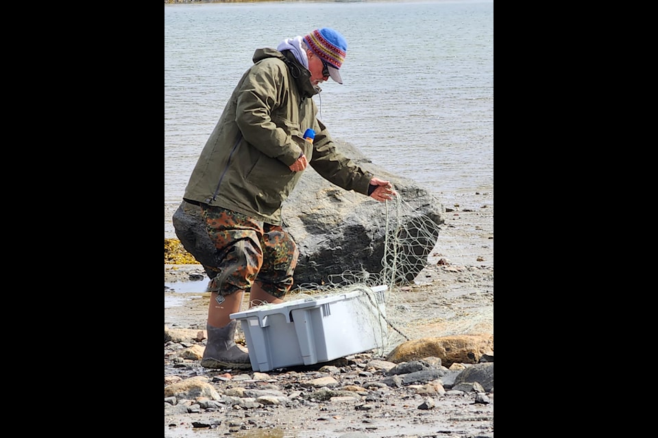 Mike Shouldice tends to his fishing nets in Rankin Inlet this past week. Photo courtesy Mike Shouldice