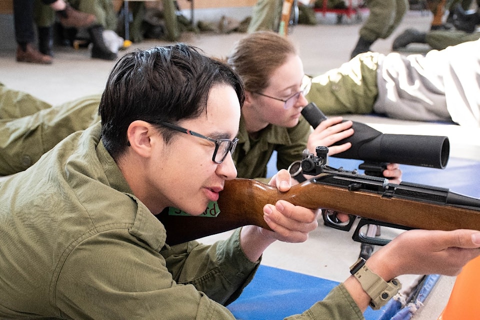Iqaluit air cadet Brogan Savard practises marksmanship techniques by firing a Daisy 853C air rifle at competition targets at the Whitehorse Cadet Training Centre in August.