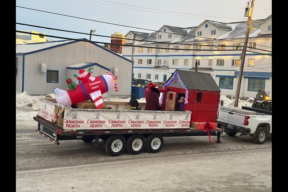 The Canadian North float showed Santa taking off from the North Pole on a Canadian North jet, explaining his early arrival in Iqaluit.