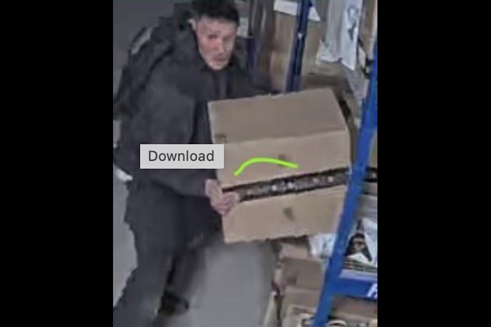 A male suspect was captured on a surveillance camera looking through mail and various packages at the Iqaluit post office.