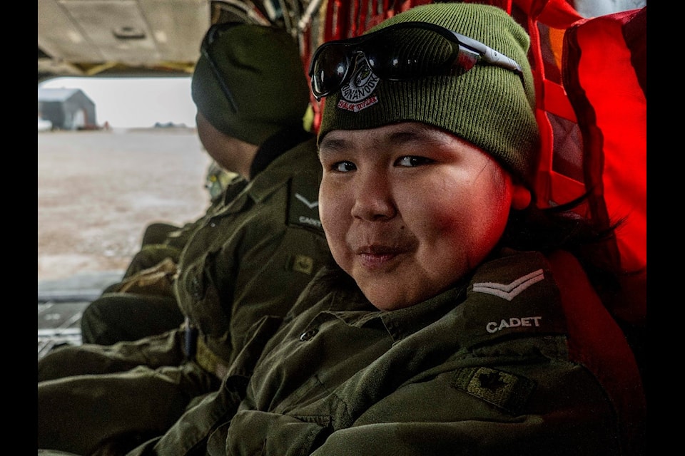 Cadet Cpl. Jake Otokiak is seated in flight on a Chinook helicopter on Oct. 1.