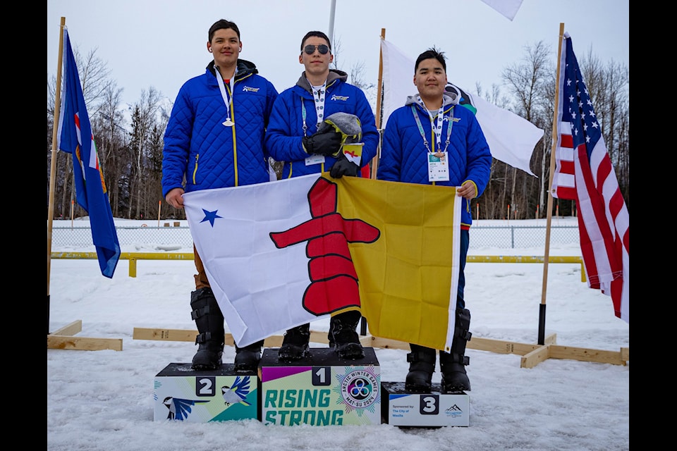 It was a podium sweep for Arctic Bay in the U18 boys snow snake, a Dene games discipline, at the Arctic Winter Games in Alaska. They are, from left, silver uluit Levi Natanine, gold uluit David Joe Audlakiak and bronze uluit Marcus Kigutaq. They may get the chance to compete on home soil in 2030 if the territory decides to go ahead with a bid to host that year. Photo courtesy of 2024 Arctic Winter Games