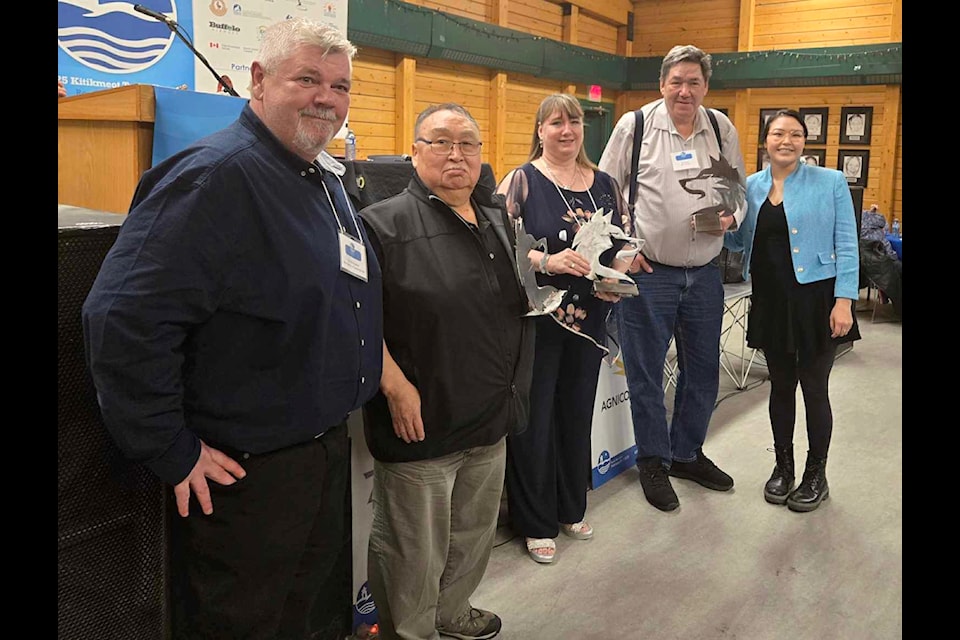 Awards night at the 2025 Kitikmeot Trade Show held in Cambridge Bay. At left is Jim MacEachern, chief operating officer of the Municipality of Cambridge Bay. Representing the partner sponsors, second from left: B2Gold's supervisor of community relations John Kaiyogana; Qillaq Innovations general manager Sandi Gillis, Umingmak Lodge bed and breakfast owner Wilfred Wilcox, and Talia Maksagak, executive director of the Kitikmeot Chamber of Commerce. Navalik Tologanak/NNSL photo