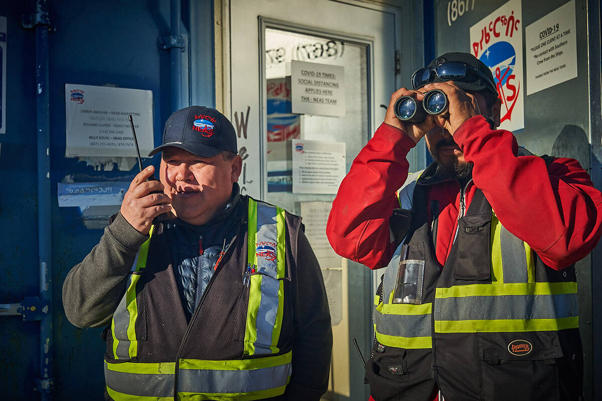 Local NEAS representatives, Jimmy Akavak and Billy Kovic, on sealift watch at the Iqaluit Beach Office, NU.