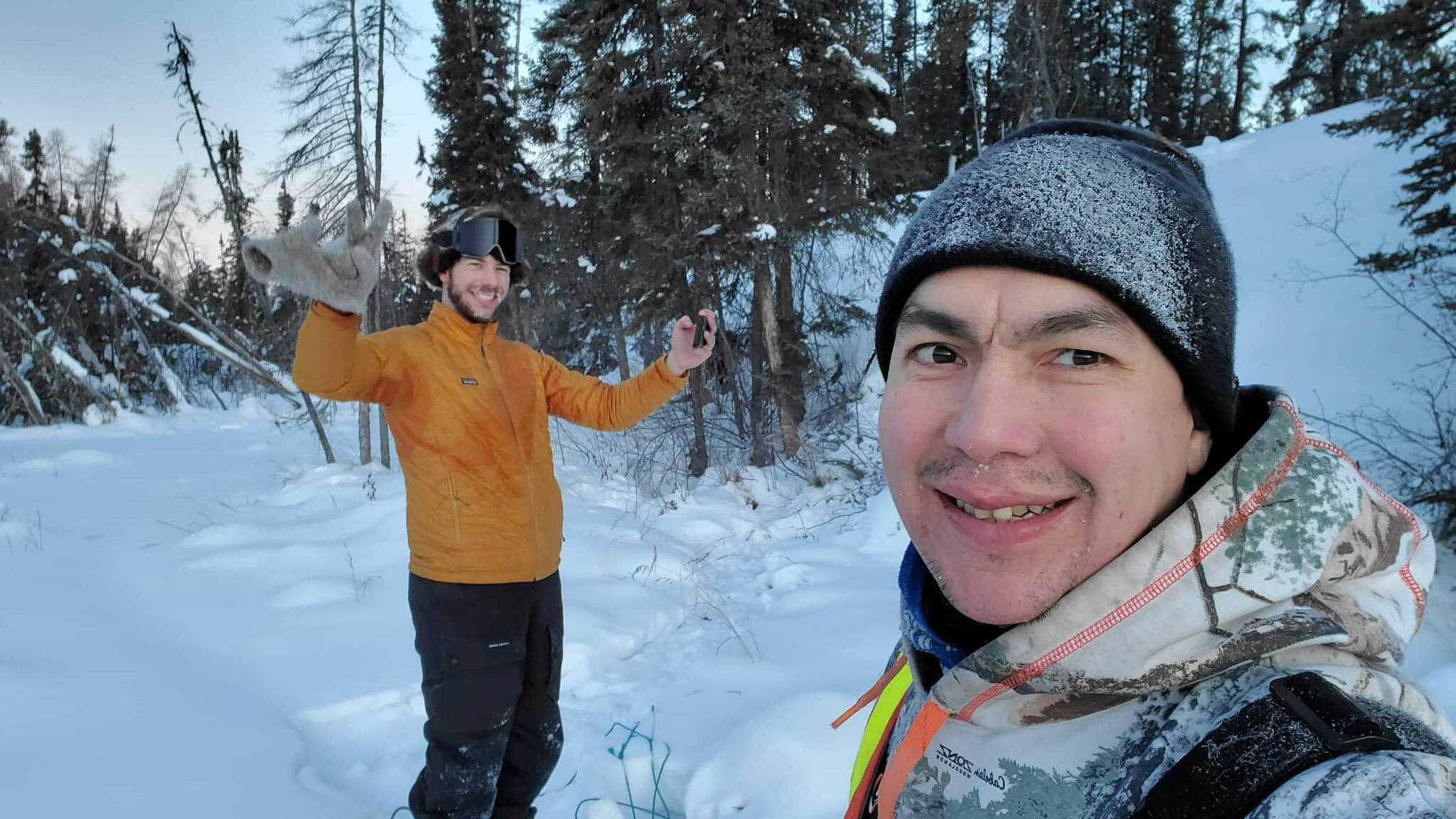 These two adventurous men from Cambridge Bay, Nunavut, Amory Wood, left, and Brent Nakashook, were out on the Ingraham Trail near Yellowknife, NT, busy hauling a sled by foot to get ready for their snowmobile journey from Yellowknife to Cambridge Bay. Lots of deep snow and too many trees! Photo courtesy of Navalik Tologanakᐅᑯᐊ ᐱᓕᕆᒃᑲᐃᑦ ᐊᖑᑎᑦ ᐃᖃᓗᒃᑑᑦᑎᐊᕐᒥᐅᑕᑦ, ᓄᓇᕗᒻᒥ, ᐊᐃᒧᕆ ᕗᑦ, ᓴᐅᒥᖕᒥ, ᐊᒻᒪ ᐳᕋᓐᑦ ᓇᑲᓱᒃ ᐃᙳᕋᒻ ᐃᒡᓕᓂᖓᓂ ᔭᓗᓇᐃᕝ, ᓄᓇᑦᓯᐊᖅ ᖃᓂᒋᔭᖓᓂ, ᐅᓯᕗᑦ ᖃᒧᑎᖕᒥ ᐱᓱᒃᖢᑎᒃ ᐸᕐᓇᖕᓂᕐᒧᑦ ᓯᑭᑑᒃᑯᑦ ᐃᖏᕐᕋᓂᐊᕐᓂᖏᓐᓂ ᔭᓗᓇᐃᕝᒥ ᐃᖃᓗᒃᑑᑦᑎᐊᕐᒧᑦ. ᐃᑎᔪᐊᓗᖕᒥ ᐊᐳᑎᖃᕐᔪᐊᖅᐳᖅ ᐊᒻᒪ ᓇᐹᖅᑐᖃᓗᐊᖅᑐᖅ !