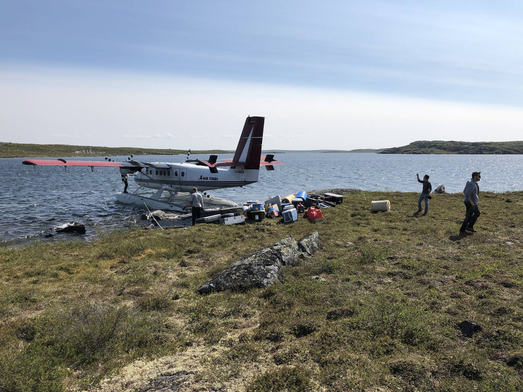 A plane is unloaded in July at North Arrow Minerals LDG lithium exploration site, which is less than five kilometres from of the winter road infrastructure connecting Yellowknife with the Lac de Gras region. Photo courtesy of North Arrow Minerals