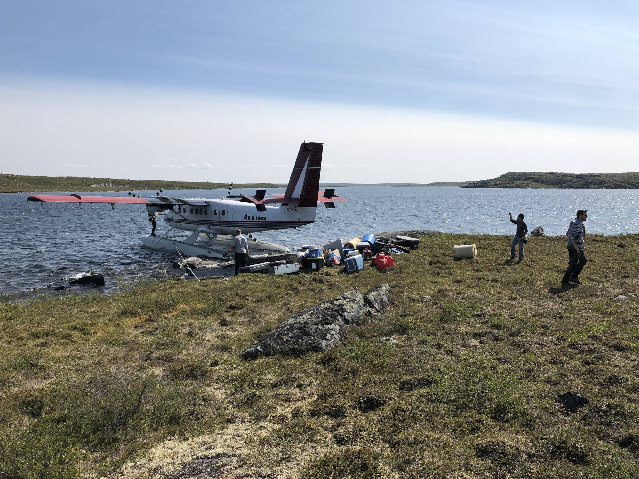 A plane is unloaded in July at North Arrow Minerals LDG lithium exploration site, which is less than five kilometres from of the winter road infrastructure connecting Yellowknife with the Lac de Gras region. Photo courtesy of North Arrow Minerals