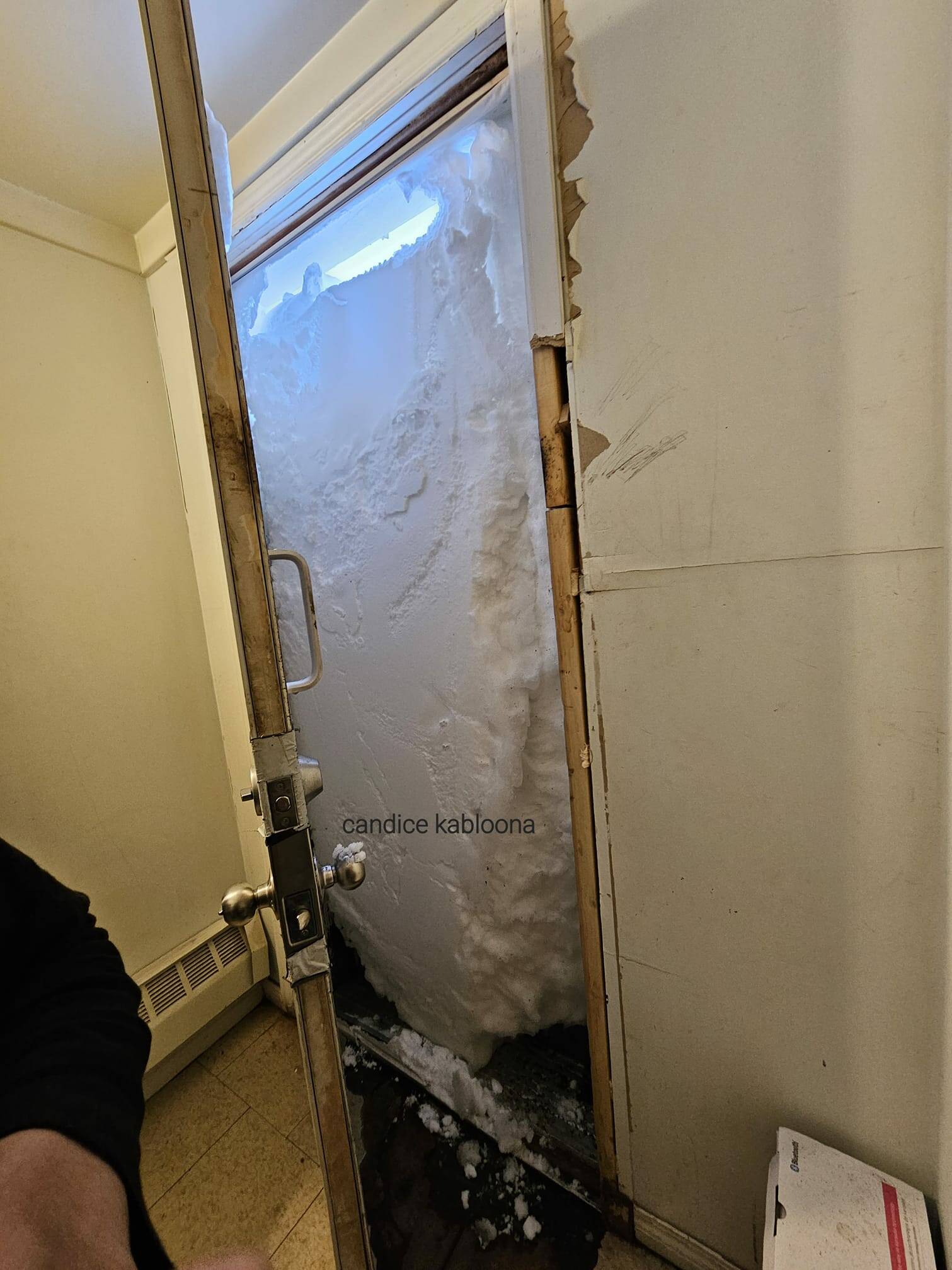 A doorway completely blocked by snow in Baker Lake. Photo courtesy of Candice Kabloona