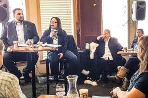 City of Iqaluit Mayor Madeleine Redfern, seated with new Iqaluit Chamber of Commerce president Matthew Clark, addresses an early-morning crowd of roughly 40 at the first monthly Breakfast Networking Speaker Series held at the Hotel Arctic April 26. - Michele LeTourneau/NNSL photo