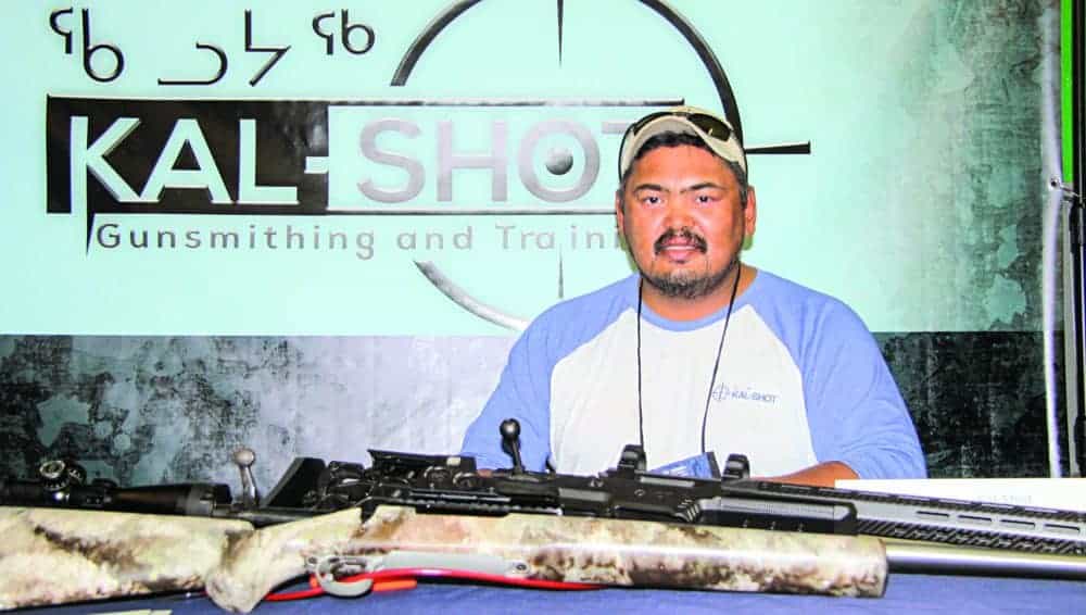 Joeffrey Kaludjak promotes his passion and part-time business (KAL-SHOT) of gunsmithing and training at the Kivalliq Trade Show in Rankin Inlet on Sept. 25, 2018. Darrell Greer/NNSL photo