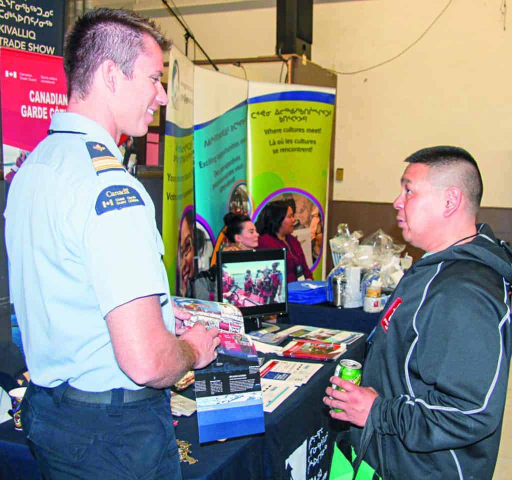 Cedric Autut, right, talks with Steve Thompson of the Canadian Coast Guard during the Kivalliq Trade Show in Rankin Inlet on Sept. 25, 2018. Darrell Greer/NNSL photo