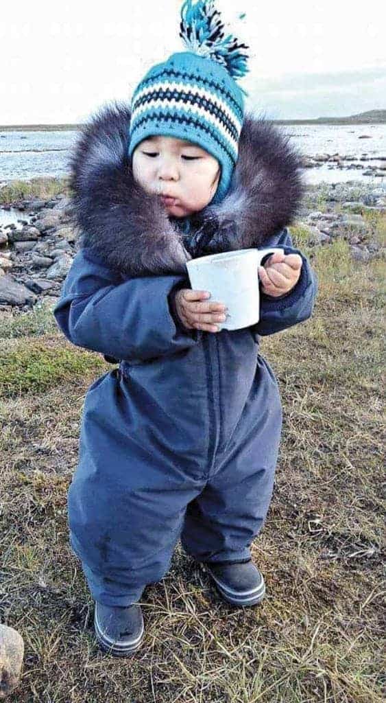 photo courtesy of Cassie Noah<br /> Rankin Inlet<br /> My son Jaden Noah having a cup of tea a couple years ago at Diane River in Rankin.