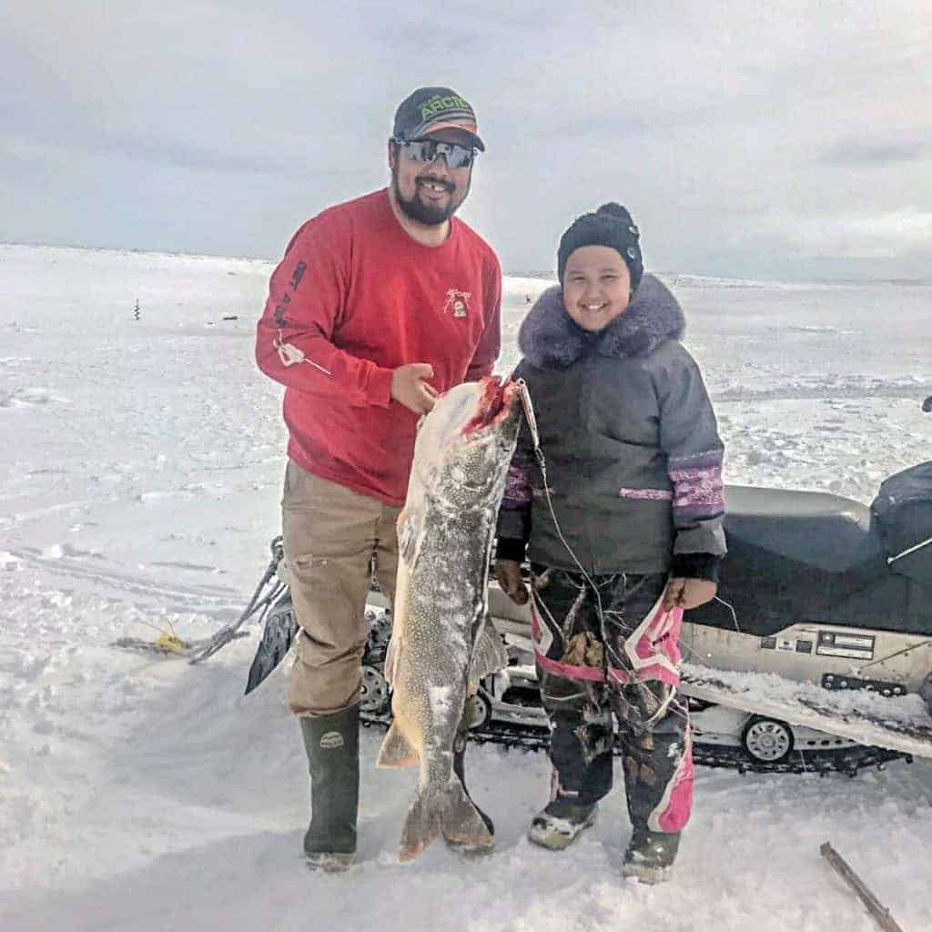 photo courtesy of Dianna Joy Kaludjak<br /> Rankin Inlet<br /> Sophia Kaludjak, age 10, with her dad, Leo Kaludjak, at Peter Lake holding her big trout measuring 43-1/8", that she pulled out herself.