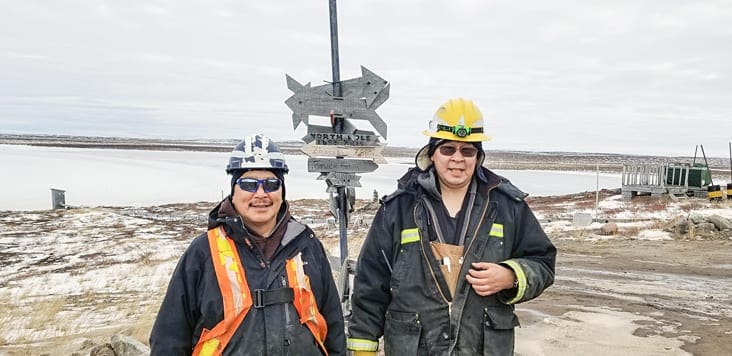 Taloyoak's Kokiak Peetooloot, left, and Jimmy Porter of Gjoa Haven are Sabina Gold and Silver employees working at the Goose camp, approximately 75 km southwest of Bathurst Inlet. Sabina provides training on various pieces of equipment and puts a great deal of emphasis on safety, Porter says. Photo courtesy of Sabina Gold & Silver.