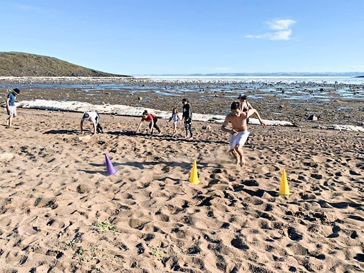 Aiden Anawak of Iqaluit heads for the pylons during a drill as part of the Volleyball Nunavut beach volleyball training camp in Apex, just outside of Iqaluit, late last month. photo courtesy of Volleyball Nunavut