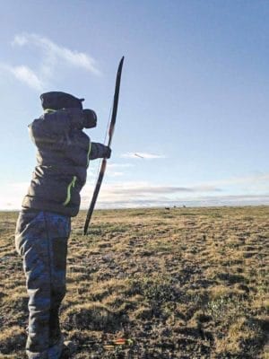 1102Peter Aqqaq_WINNER Peter Aqqaq Taloyoak Wayne Aiyout letting loose an arrow towards caribou. Photo taken near Taloyoak, August 2015.