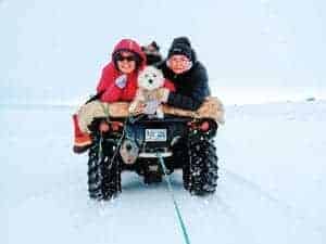 1211Hilu Tagoona Hilu Tagoona Rankin Inlet Riding in style: Jessica, CoCo, and Donna get creative so they can go ice fishing while Emily drives. I took the picture while on a toy qamutik. It was worth it, we caught four! This was at 2nd Landing Lake outside of Rankin, Sunday afternoon in zero degree temps.