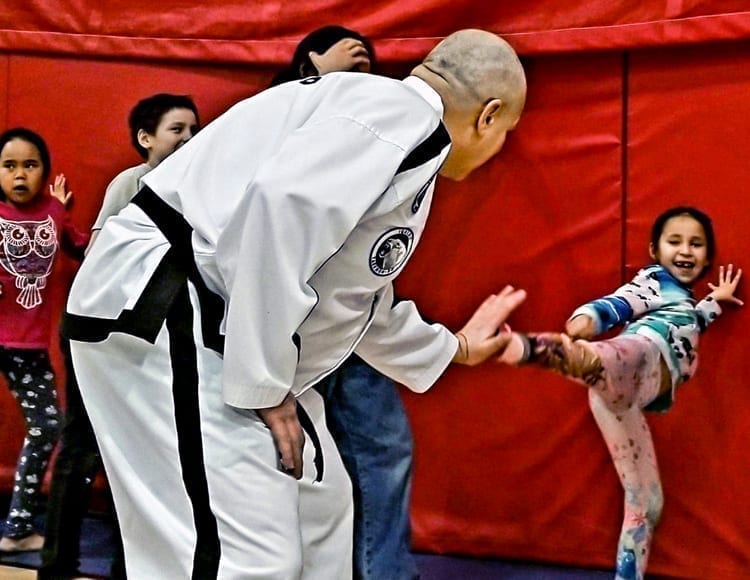 Don Peters instructs a young Tae Kwon Do student on her kicking technique during a get together of the new Tae Kwon Do club in Arviat on March 2, 2019. Photo courtesy Gord Billard