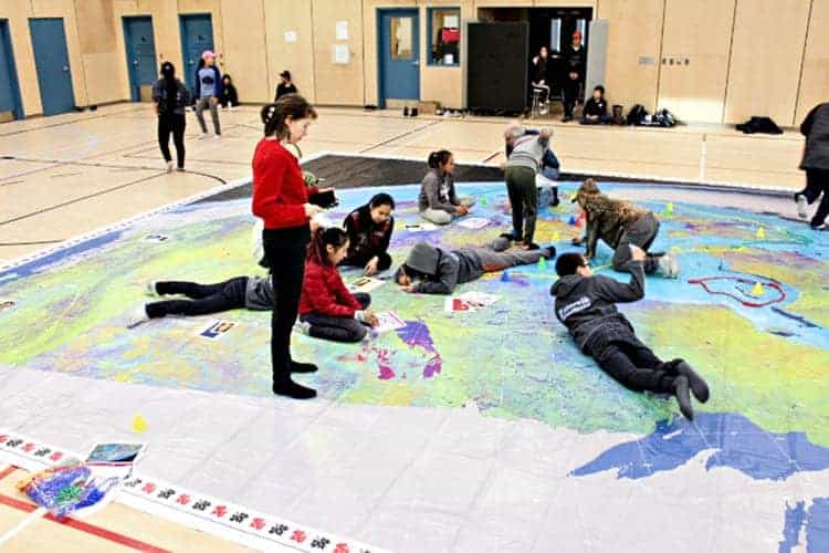 Senior high social studies teacher Shona Stacey gives instruction to students during a Giant Map of Canada activity at Tuugaalik High School in Naujaat on Oct. 10, 2018. Photo courtesy Julia MacPherson