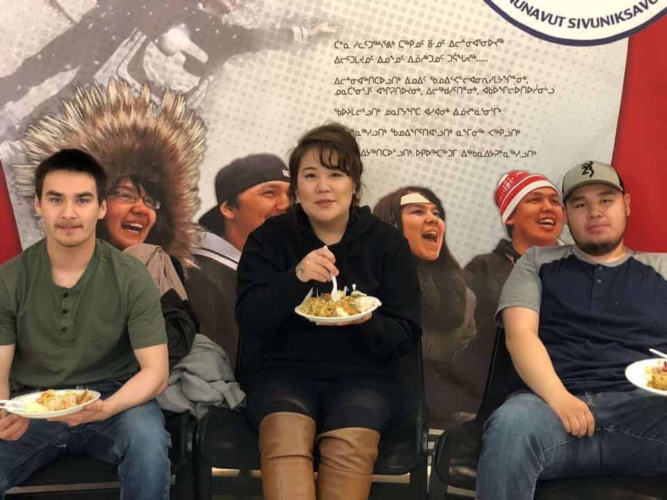 Iglulik's Philip Evaluarjuk, left, Arviat's Jillian Kaviok and Charlie Panipak of Pangnirtung are ready to devour their plates full of food.