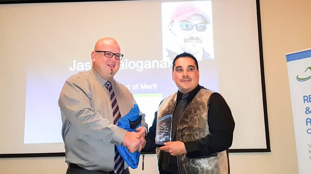 Recreation  Leader of the Year award-winner Fred Muise of Cambridge Bay presents the Canadian Parks and Recreation Association Award of Merit to Jason Tologanak, also of Cambridge Bay. (recognizes an individual/organization/corporation for an outstanding contribution to achievements in each province and territory)  2016 Sport and Recreation Awards Celebration and Dinner Oct. 15, 2016 Michele LeTourneau/NNSL photo