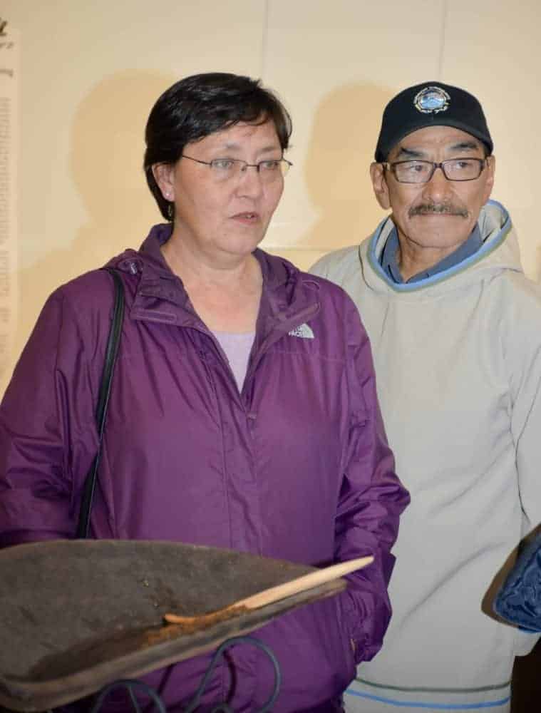 Ooloosie Ashevak, daughter-in-law of the late Kenojuak Ashevak, and Adamie Ashevak, Kenojuak's son, address the crowd during the opening ceremony at the new Kenojuak Cultural Centre and Print Shop on Sept. 5. 