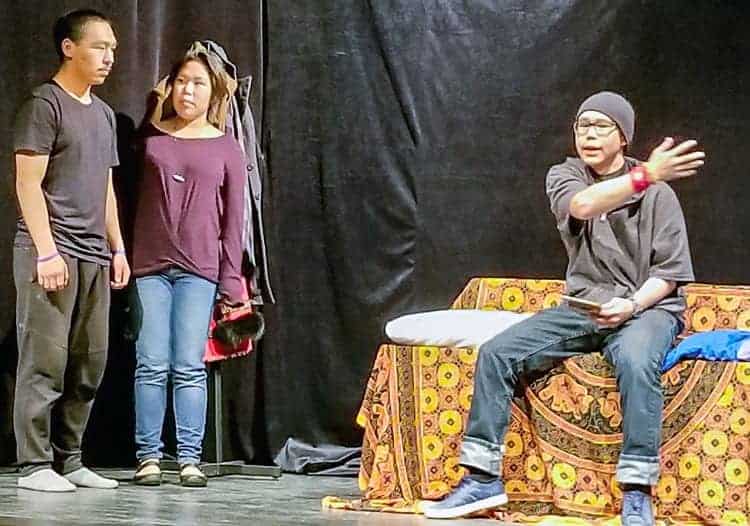 Bobby Smith (Noah Muckpah) complains to his parents, Jack (Russell Suluk) and Susan (Ocean Kidlapik), about not having the most expensive hockey stick during the Arviat Drama Club's Inuktitut presentation of A Thanksgiving to Remember in Arviat on Oct. 5, 2018. Photo courtesy Gord Billard 