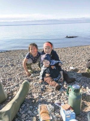 1802Helen Sikkuark Niptayok Helen Sikkuark Niptayok Kugaaruk This was summer of 2018 Janelle, Jeffrey and Lisa Niptayok. Behind them is their dad’s catch in the water.