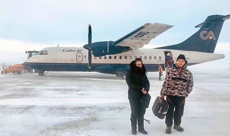 Arviat Film Society members Elena Akammak, left, and Jamie Okatsiak are happy the weather held steady just long enough for them to depart for the Nunavut film conference on March 12-13 in Iqaluit. Photo courtesy Eric Anoee