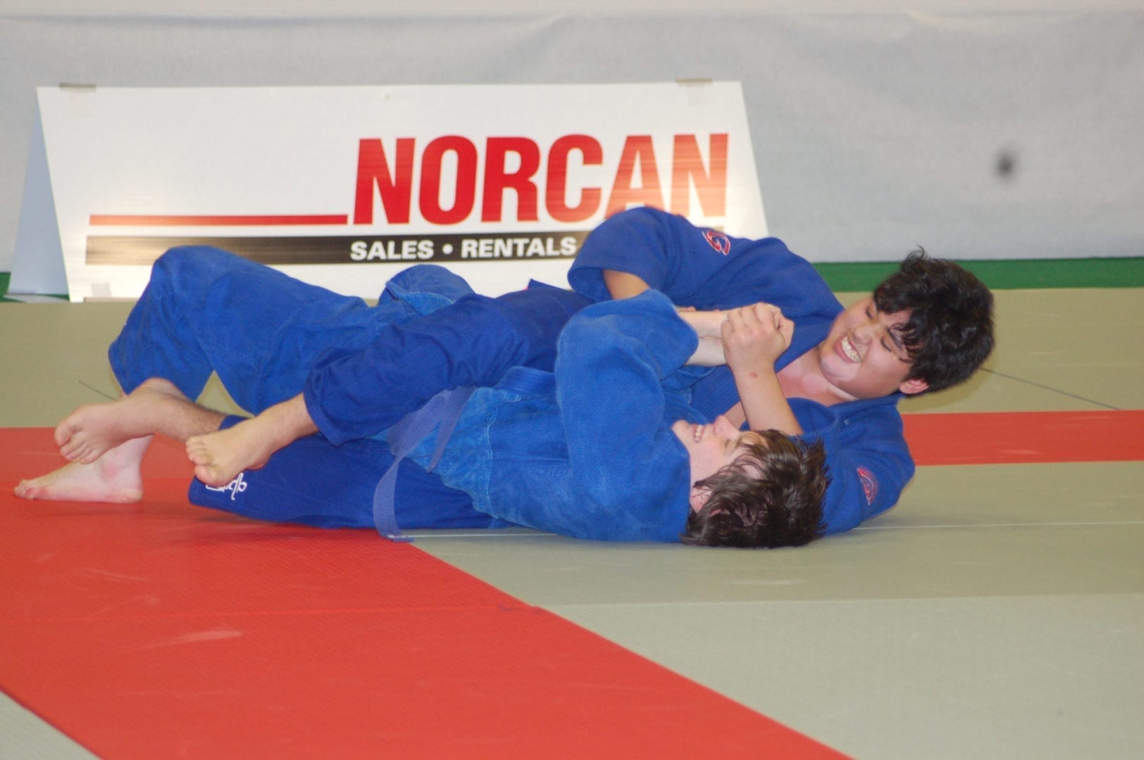 Iqaluit's Eugene Dederick, top, practices nee-waza (ground grappling) with Zachary Green at the 2007 Canada Winter Games in Whitehorse. Dederick won bronze in his weight category, the first medal for Nunavut ever at the Canada Winter Games or Canada Summer Games. NNSL file photo
