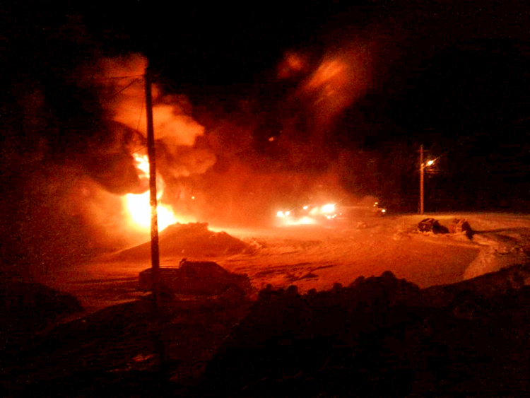 Flames light-up the darkness as a horrific fire rips through the Hamlet 6 municipal bay garage in Baker Lake during the early morning hours of Jan. 29. photo courtesy of Hamlet of Baker Lake