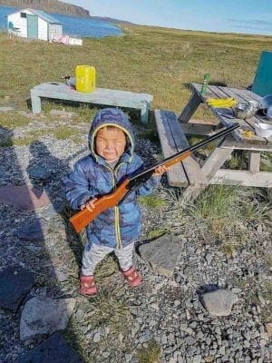 2409Cheryl Taptuna Cheryl Taptuna Kugluktuk Four-year-old Jaden Taptuna using a pellet gun, saying he’s getting the biggest caribou.