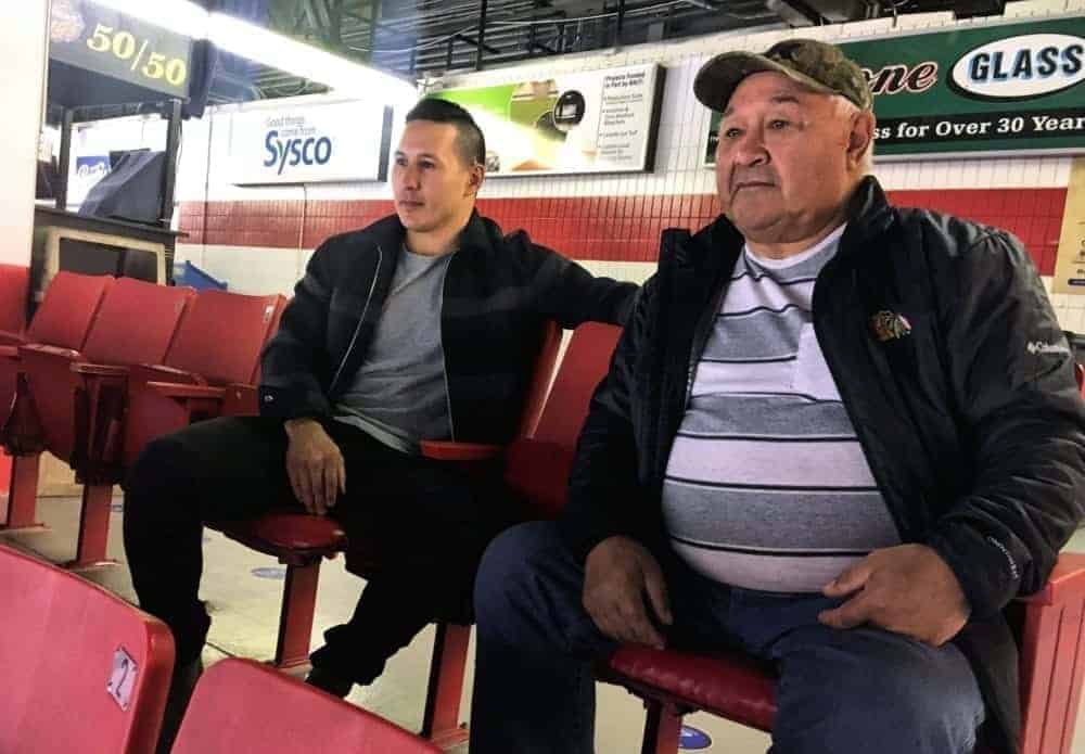 Former NHLer Jordin Tootoo of Rankin Inlet and his dad, Barney Tootoo, take in the atmosphere of the morning skate for the Brandon Wheat Kings at the Keystone Centre in Brandon, Man., on Oct. 19, 2018. Photo courtesy Wheat Kingsd family