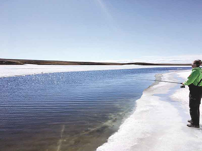 Cathryn Epp Cambridge Bay Myself, ice fishing July 2, 2018.