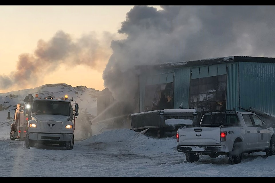 Firefighters attempt to salvage a burning storage building in Kugluktuk on Jan. 9. Photo courtesy of the Kugluktuk 