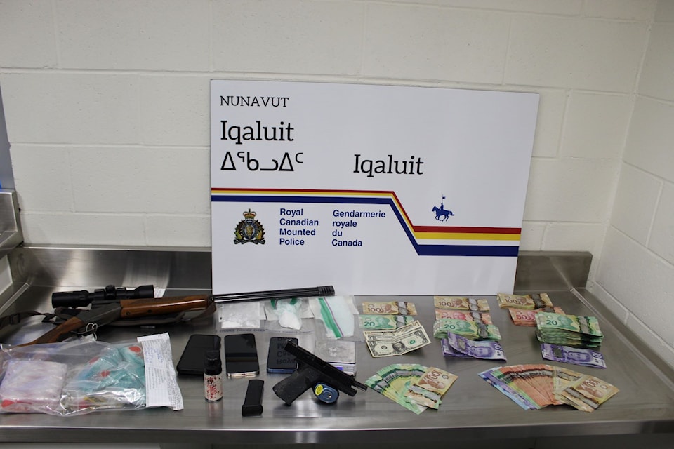 A search warrant executed by Iqaluit  on Jan. 24 turned up drugs, cash and multiple firearms. Photo courtesy of 