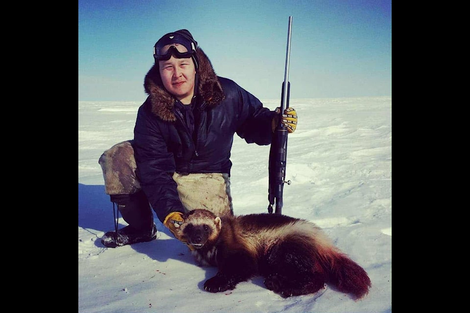 Gleason Uppahuak displays a wolverine he captured on one of his frequent hunting trips outside of Arviat. Photo courtesy Gleason Uppahuak
