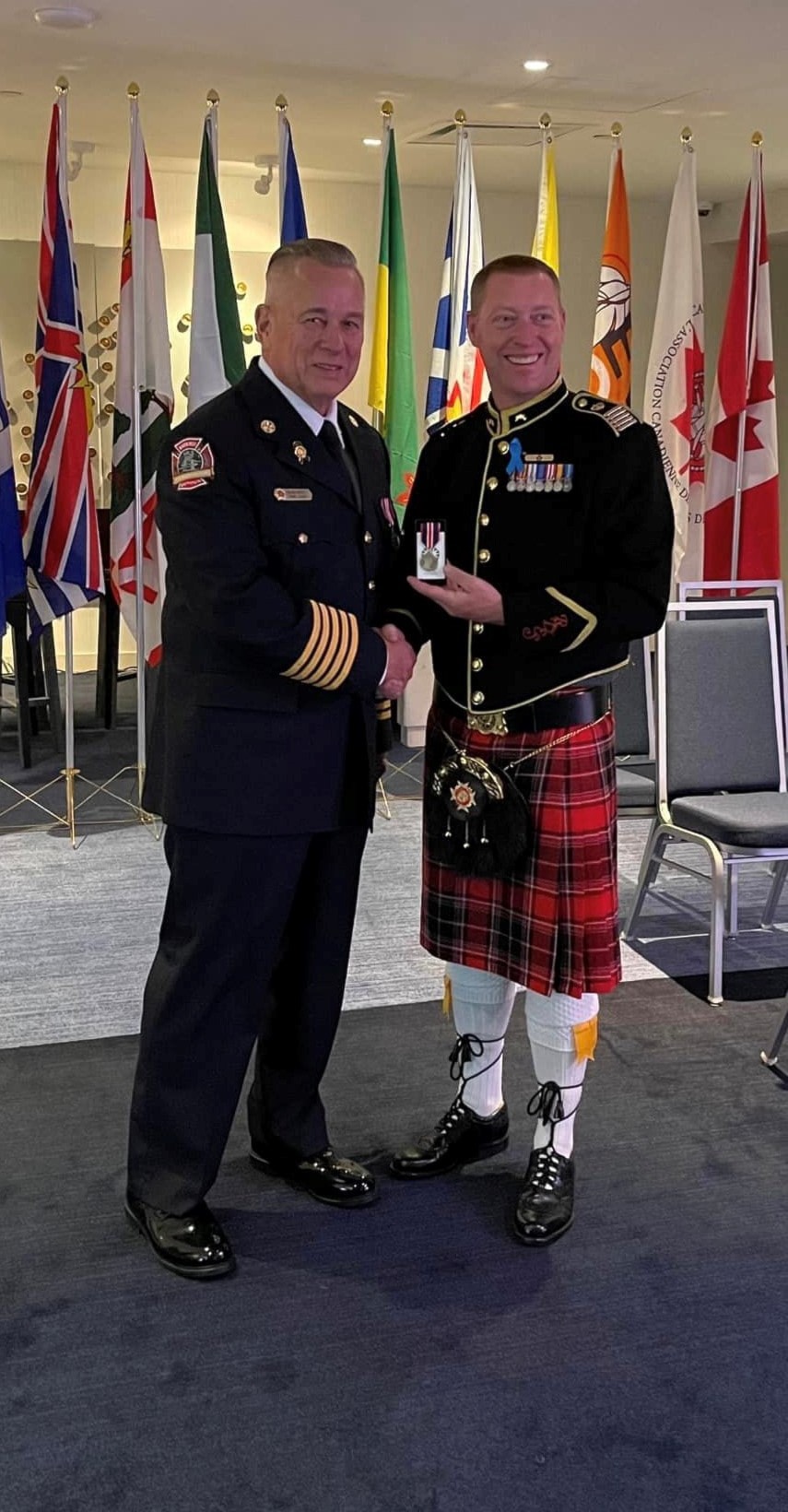 241106-kiv-firechiefrecognizedphoto