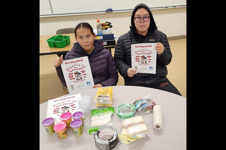 Tatiana Tanuyak, left, and Pasha Mullins prepare to take part in the annual STEM Challenge at Victor Sammurtok School in Chesterfield Inlet on Friday, Nov. 29.