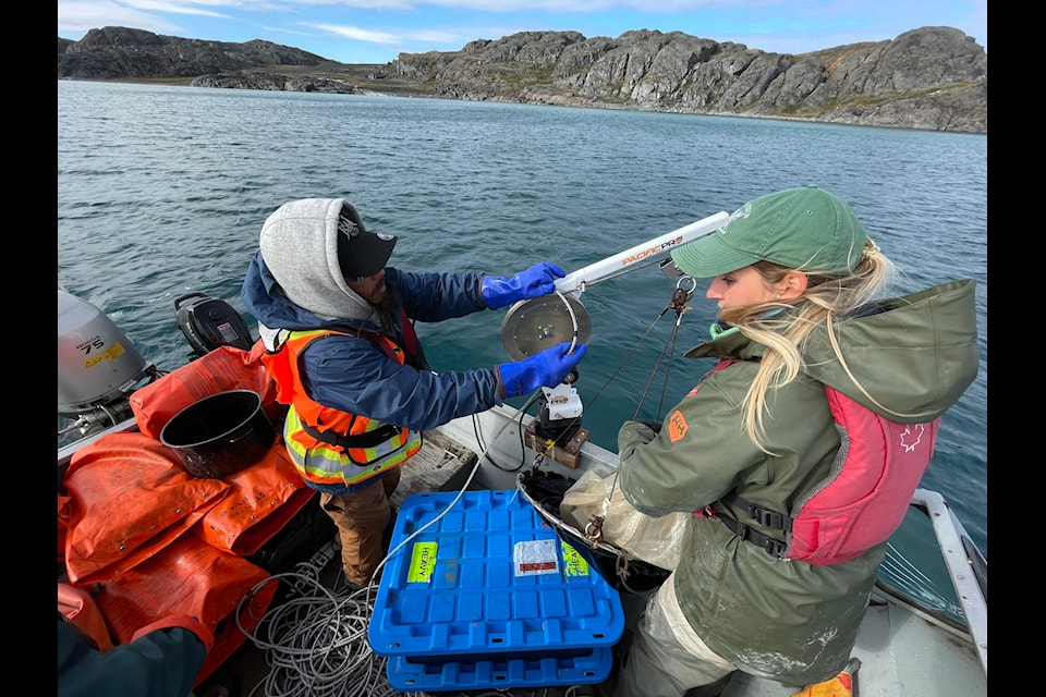 Collecting sediment samples from the ocean floor near the port site.