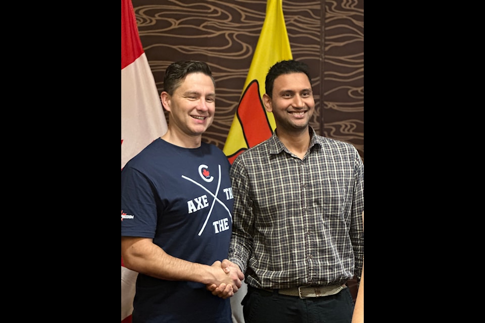Badri Mani has his photo taken with federal Conservative leader Pierre Poilievre in Iqaluit on Sept. 9.