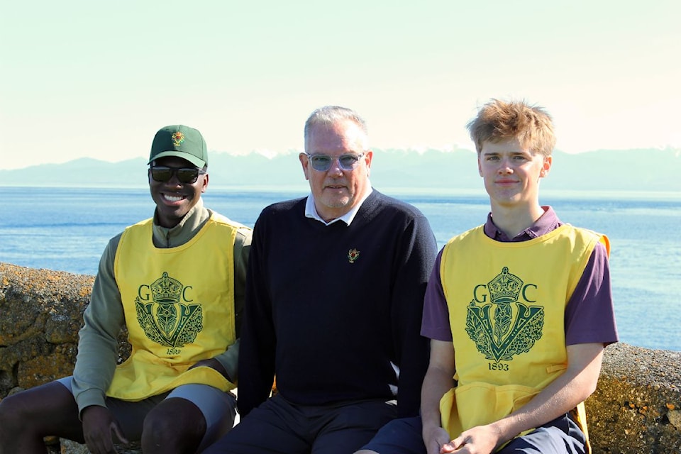 Joe Harris (left), Guy Crozier, and Connor Meir, all proud members of the Victoria Golf Club caddy program