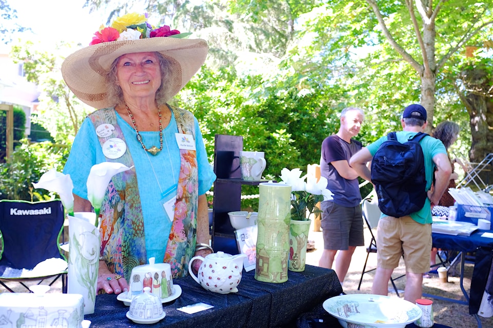 Oak Bay Community Artists Society president Flo-Elle Watson poses at the 25th Bowker Creek Brush-Up art show on Sunday, Aug. 10.