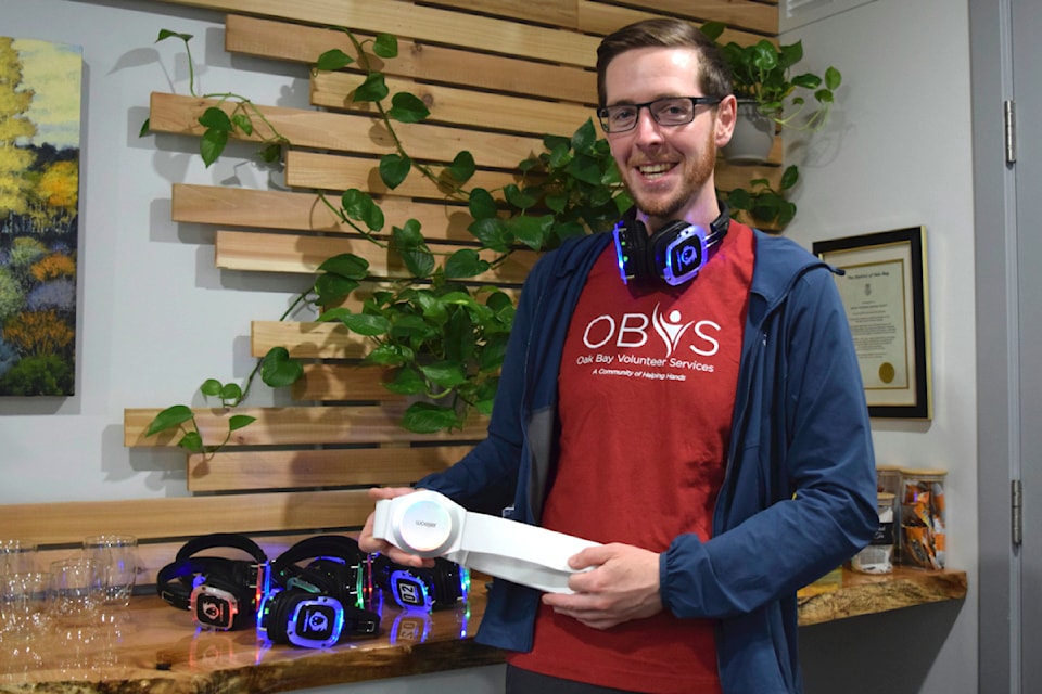 Outreach and Services Coordinator Bradley Terpstra holds Oak Bay Volunteer Services' silent disco rumble belt