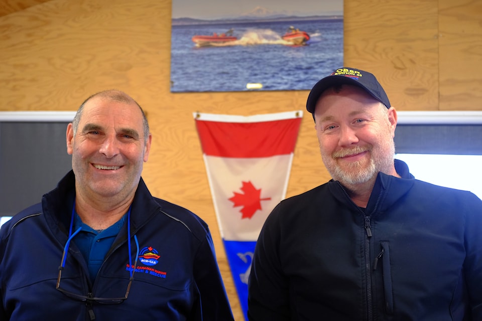 Station leader Eddy Halloran (left) and deputy Jonathan Cobham stand at the rescue team’s operation centre - a boathouse at the Oak Bay Marina.