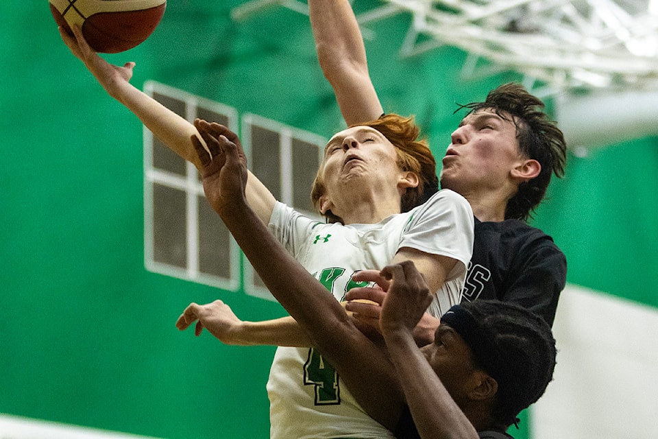 An Oak Bay Bay goes in for a layup against the Belmont Bulldogs in the opener of the Gary Taylor Classic. The final score was 104 to 44 for the Bays.
