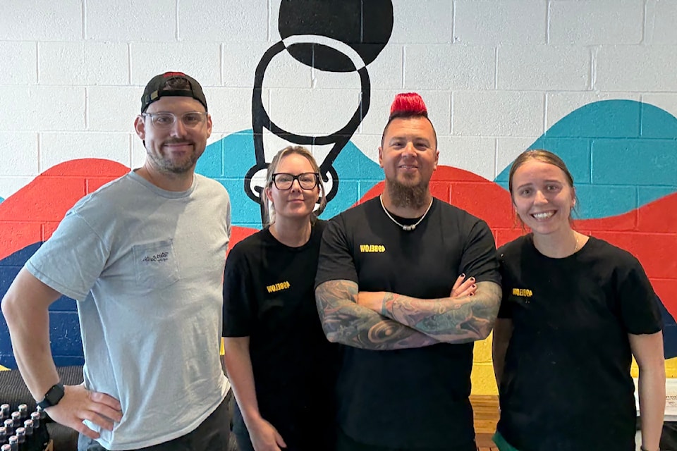 Dan Edler, Kelsea McLaughlin, Jared Qwustenuxun Williams and Jade McKee are all smiles crafting the latest philanthropint in Oak Bay.
