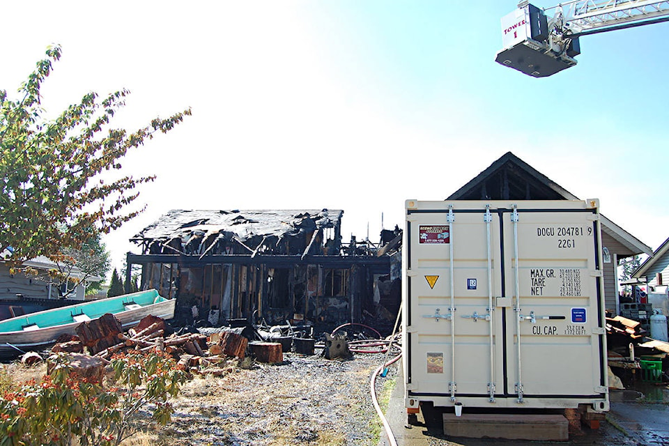 Flames destroyed a home at 2335 Henderson Ave. on Tuesday morning. No injuries were reported. Photo by David Gordon Koch/Campbell River Mirror