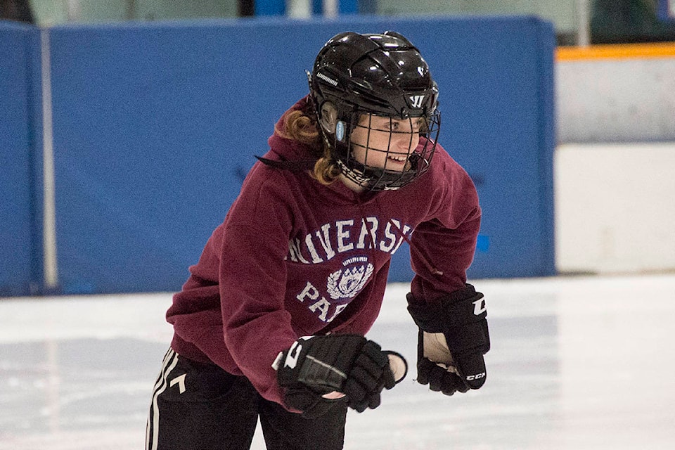 Sabine Bailey, 12, races around the Archie Browning Sports Centre arena during Speed Week, a province-wide speed skating competition Dec. 17. (Nina Grossman/News Staff)